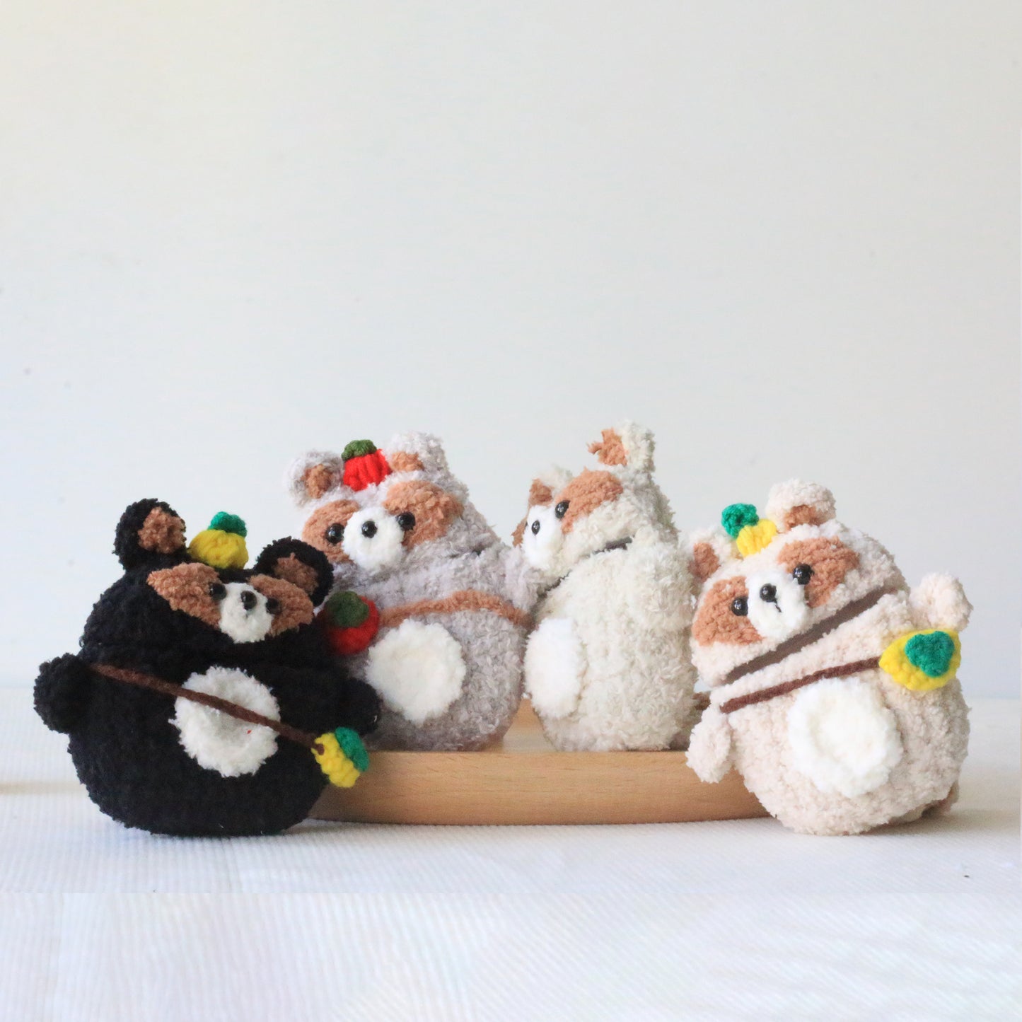 The Raccoon Family Crochet AirPods Cases